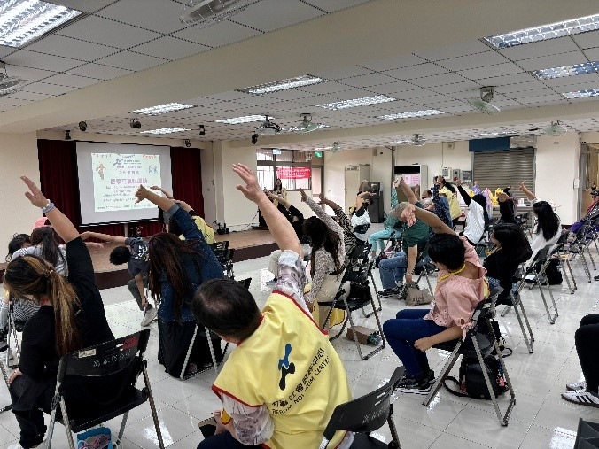 a tree with green leaves and chairs in a room with a staircase