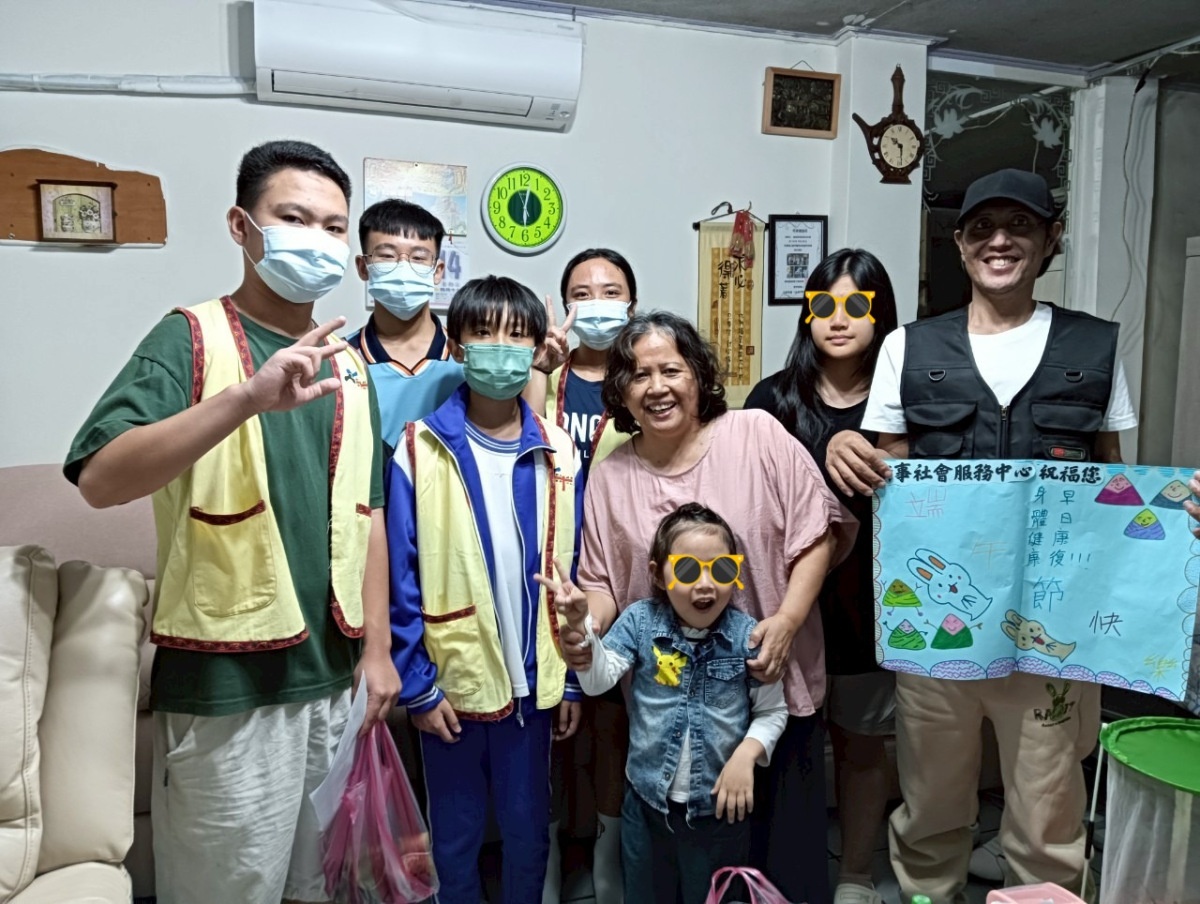 a tree with green leaves and chairs in a room with a staircase